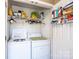 Functional laundry area featuring a washer and dryer, wire shelving, and organized storage solutions at 1636 Samaria Ln, Conover, NC 28613