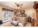 Comfortable main bedroom with carpet, ceiling fan, and a large window for ample natural light at 1636 Samaria Ln, Conover, NC 28613