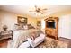 Spacious main bedroom suite with a ceiling fan, ensuite bath and patterned bedding at 1636 Samaria Ln, Conover, NC 28613