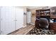 Neutral toned office space with wood floors, built in shelving, and natural light at 1636 Samaria Ln, Conover, NC 28613