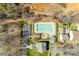 Aerial view of the community pool, clubhouse, parking, and surrounding landscape, perfect for relaxation and recreation at 19009 Coachmans Trce, Cornelius, NC 28031