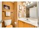 Bathroom featuring a vanity with cabinets, mirror, and decorative wall art for a charming touch at 19009 Coachmans Trce, Cornelius, NC 28031