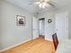 Bedroom with hardwood floors, neutral walls, ceiling fan, and closet at 19009 Coachmans Trce, Cornelius, NC 28031