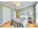 Comfortable bedroom with ceiling fan and light-filled windows, perfect for relaxation at 19009 Coachmans Trce, Cornelius, NC 28031