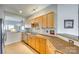 Bright kitchen with wood cabinets, countertops, tile backsplash and stainless steel appliances at 19009 Coachmans Trce, Cornelius, NC 28031
