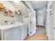 Convenient laundry room with appliances and storage shelving, plus access to the front foyer at 19009 Coachmans Trce, Cornelius, NC 28031