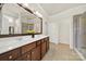 Bathroom with a double vanity, spacious countertop, and separate shower area for modern convenience at 2035 Vermount Way, Fort Mill, SC 29707