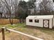 The property boasts a spacious backyard with a shed at 211 W 1St St, Landis, NC 28088