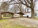 The property boasts a spacious backyard with sheds and parking at 211 W 1St St, Landis, NC 28088