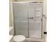 Bathroom showcasing shower stall with a sliding door, grab bar, and built-in shelves at 211 W 1St St, Landis, NC 28088