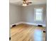 This bedroom features hardwood floors and natural light from a window at 211 W 1St St, Landis, NC 28088