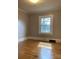 Cozy bedroom with hardwood floors and a window providing natural light at 211 W 1St St, Landis, NC 28088