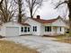 Charming home featuring a well-maintained yard and an attached garage at 211 W 1St St, Landis, NC 28088