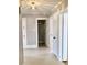 Hallway view with neutral flooring and multiple doors leading to various rooms at 211 W 1St St, Landis, NC 28088
