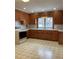 This kitchen features ample counter space, wood cabinetry, and classic appliances at 211 W 1St St, Landis, NC 28088