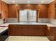 The kitchen boasts wooden cabinets, lots of storage, and a large sink at 211 W 1St St, Landis, NC 28088