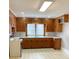 This kitchen features ample storage and countertop space with a neutral color scheme at 211 W 1St St, Landis, NC 28088