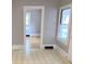 The living room features neutral walls and flooring, and access to other rooms in the house at 211 W 1St St, Landis, NC 28088