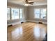 Bright living room featuring gleaming hardwood floors, fresh paint, and natural light from the windows at 211 W 1St St, Landis, NC 28088