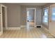 The living room has neutral walls and flooring, and features access to other rooms in the house at 211 W 1St St, Landis, NC 28088