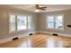 Cozy living room with hardwood floors and large windows, creating a warm and inviting atmosphere at 211 W 1St St, Landis, NC 28088