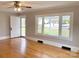 Sunlit living room with gleaming hardwood floors and large windows at 211 W 1St St, Landis, NC 28088