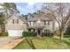 Charming two-story home boasts a well-manicured lawn and a welcoming front porch, perfect for enjoying the outdoors at 2157 Tommy Ln, Matthews, NC 28105