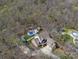 Aerial view of a beautiful home on a large lot featuring an in-ground pool and detached garage at 3024 Beaver Dam Dr, Monroe, NC 28110