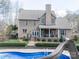 Large backyard featuring an in-ground pool, a covered porch, and a well-maintained lawn at 3024 Beaver Dam Dr, Monroe, NC 28110