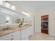 Main bathroom with double vanity, large mirror, and walk-in closet at 3024 Beaver Dam Dr, Monroe, NC 28110