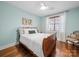 A cozy bedroom featuring a wooden bed frame and hardwood floors at 3024 Beaver Dam Dr, Monroe, NC 28110