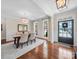 Bright dining room with hardwood floors, chandelier, and large windows, perfect for Gathering gatherings at 3024 Beaver Dam Dr, Monroe, NC 28110