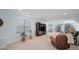 Large bonus room with large windows and entertainment area with ping pong table at 3024 Beaver Dam Dr, Monroe, NC 28110