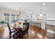 Eat-in kitchen with wooden floors, large island, and access to outdoor spaces at 3024 Beaver Dam Dr, Monroe, NC 28110
