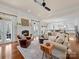 Living room with fireplace, hardwood floors, and open access to the kitchen at 3024 Beaver Dam Dr, Monroe, NC 28110