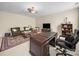 Office space features a large desk, couch, and built-in shelves at 3024 Beaver Dam Dr, Monroe, NC 28110