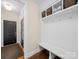 Mud room featuring a bench, storage, and hooks for coats and bags at 3024 Beaver Dam Dr, Monroe, NC 28110