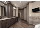 Bathroom featuring double sinks, granite countertops, custom cabinetry, and walk-in shower at 3200 Beaty Rd, Gastonia, NC 28056