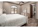 Bedroom featuring hardwood flooring, lots of light, and a dresser with a mirror at 3200 Beaty Rd, Gastonia, NC 28056