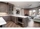 Bright kitchen featuring an island with an oven, sink, and a view to Gathering space at 3200 Beaty Rd, Gastonia, NC 28056