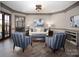 Elegant living room featuring hardwood floors, crown molding, and stylish furniture at 3200 Beaty Rd, Gastonia, NC 28056