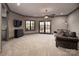 Large living room with recessed lighting, carpet floors, and access to an outdoor balcony at 3200 Beaty Rd, Gastonia, NC 28056