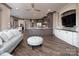 Open-concept living area with modern kitchen, living room seating, and hardwood floors at 3200 Beaty Rd, Gastonia, NC 28056