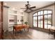 Bright office with built-in shelving, custom wood desk, hardwood flooring, and large window for natural light at 3200 Beaty Rd, Gastonia, NC 28056