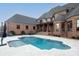 Beautiful backyard featuring a sparkling pool, brick house, and outdoor seating area at 3200 Beaty Rd, Gastonia, NC 28056