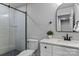 Modern bathroom featuring glass enclosed shower, subway tile surround, and black hardware details at 3324 Flamingo Ave, Charlotte, NC 28205