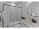 Modern bathroom featuring subway tile surround, shower-tub combination, and black hardware details at 3324 Flamingo Ave, Charlotte, NC 28205