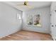Well-lit bedroom with hardwood flooring, a large window, and ample natural light at 3324 Flamingo Ave, Charlotte, NC 28205
