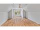 Spacious, well-lit bonus room with hardwood floors and a modern ceiling fan at 3324 Flamingo Ave, Charlotte, NC 28205