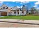 Charming two-story home with a well-manicured lawn, a covered front porch, and a tandem two car garage at 3324 Flamingo Ave, Charlotte, NC 28205
